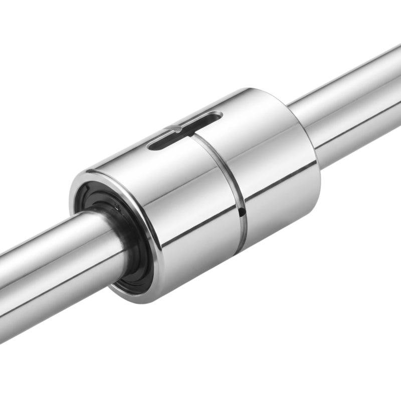 A close-up of a shiny metal linear bearing mounted on a cylindrical rod, with a slot visible on the outer surface of the bearing.