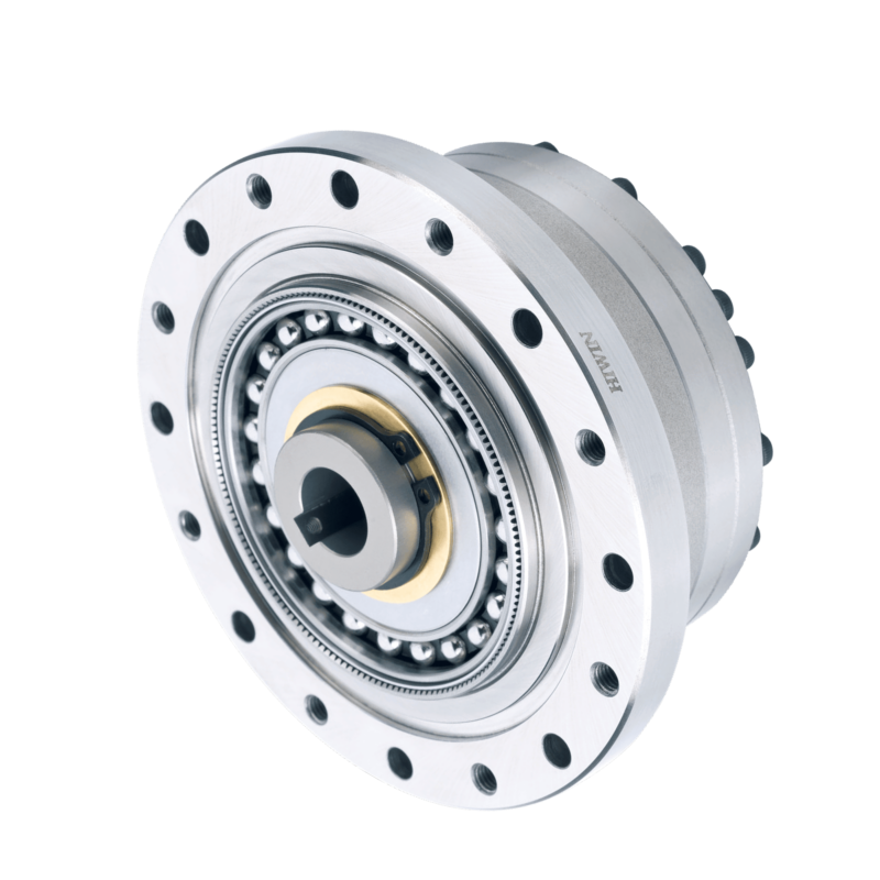 A close-up of a metallic harmonic drive gear mechanism with precision ball bearings and multiple circular holes, used in robotics and automation.