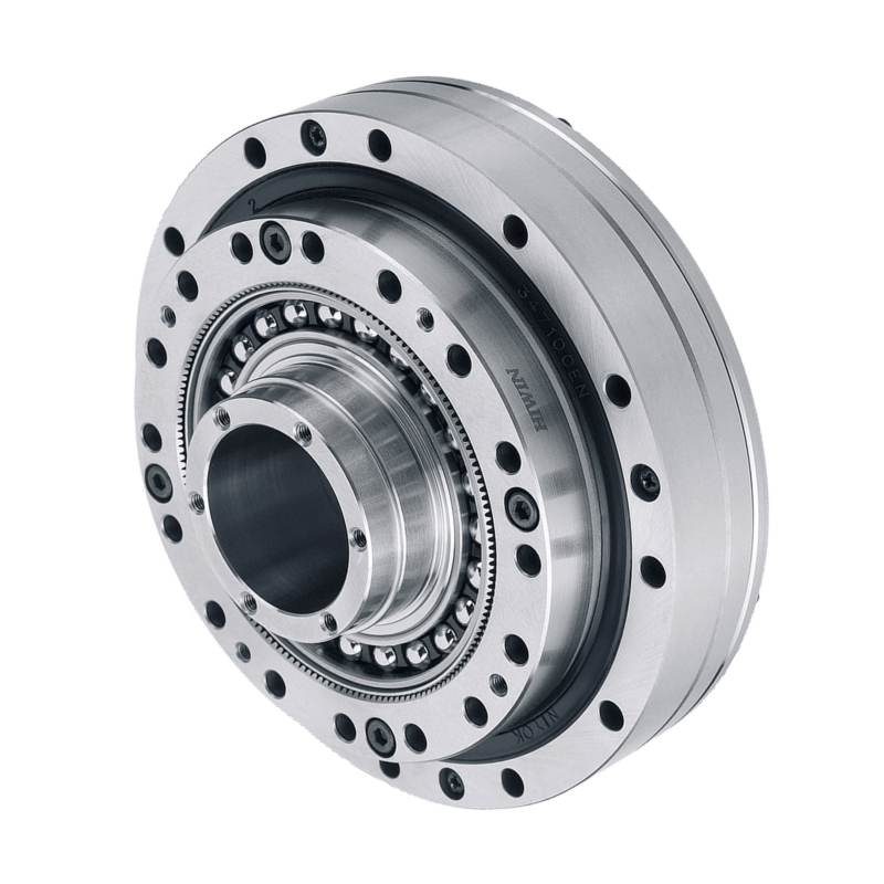 A close-up of a metallic harmonic drive gear with precision holes, ball bearings, and interlocking circular components, shown on a plain white background.