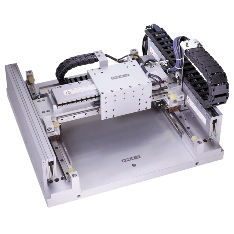 A linear motion stage with metal rails, cables, and a motorized platform for precision positioning, commonly used in automation, robotics, or laboratory equipment.