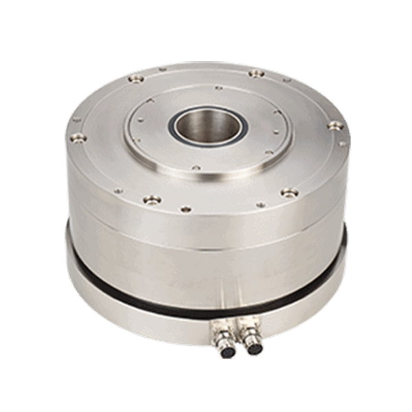 A metal cylindrical device with a central hole, multiple bolt holes on the top surface, and two cable connectors at the bottom front. The background is white.