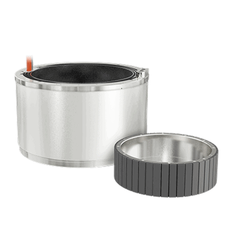 A cylindrical metal component with smooth sides is shown next to a separate, smaller ring with dark, grooved segments. Both are set against a white background.